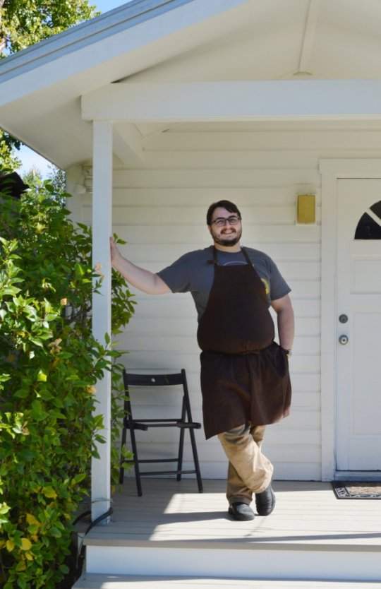 man in front of building